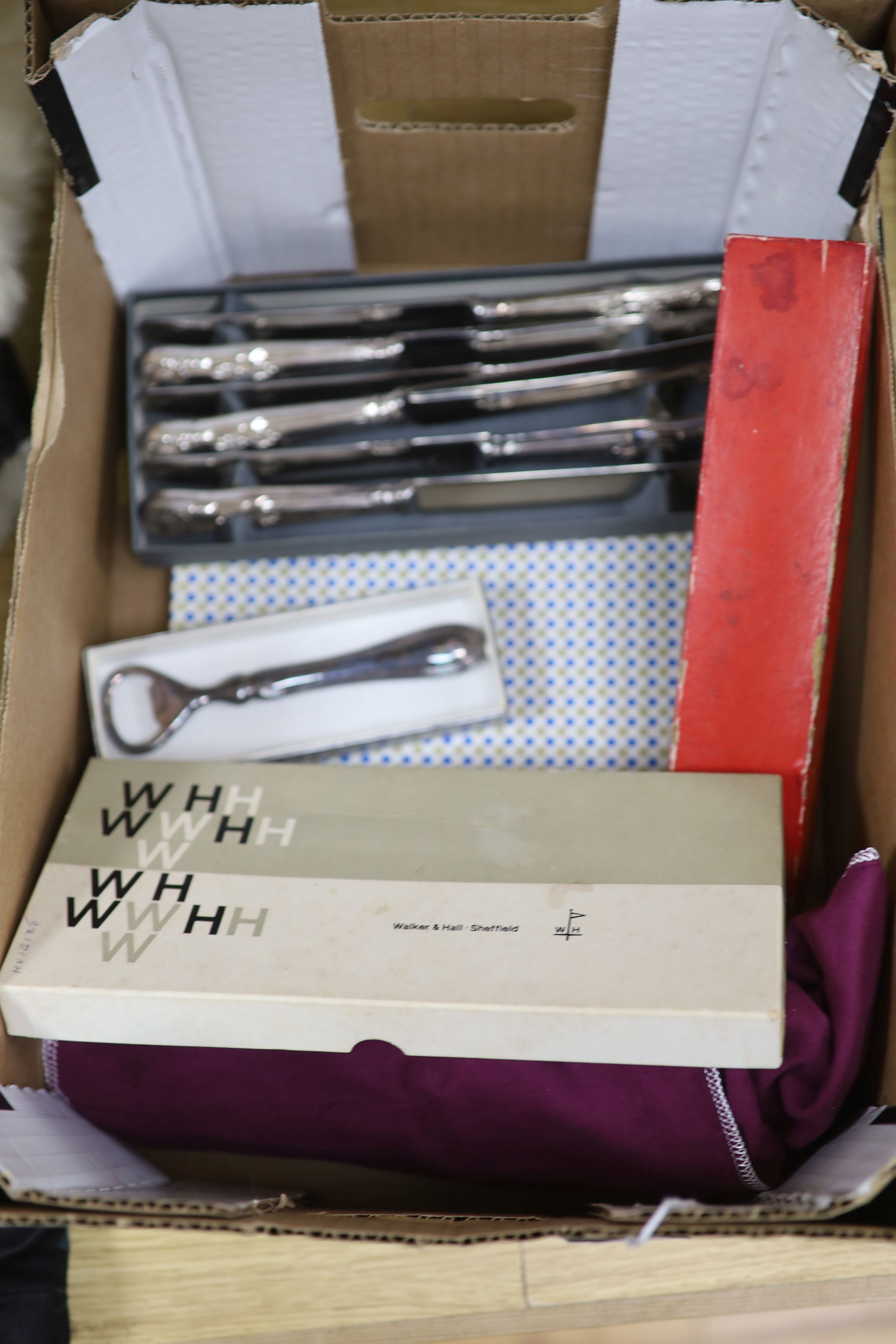 A set of twelve silver plated table and dessert knives(24), two other cased sets of six knives, a three piece carving set and a bottle